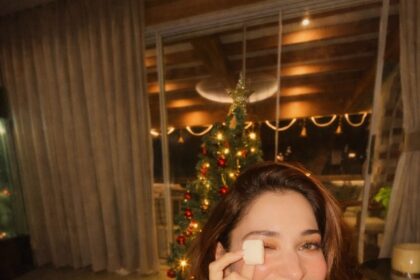 तमन्नाह भाटिया रेड सैटिन पजामा सेट में हॉलिडे लुक के साथ