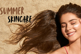 A woman lying on sand with glowing skin, applying sunscreen on her face, representing summer skincare and sun protection. The image highlights healthy, radiant skin during summer with the text “Summer Skincare” displayed.