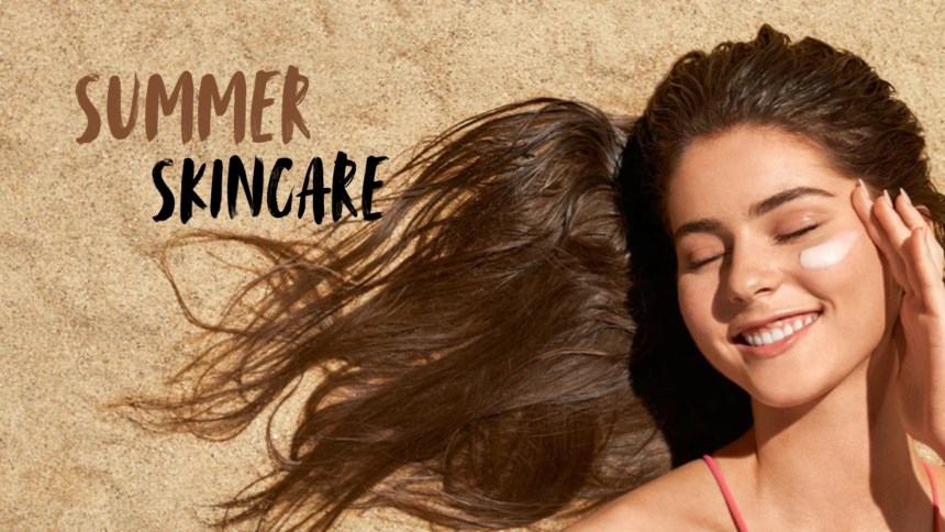 A woman lying on sand with glowing skin, applying sunscreen on her face, representing summer skincare and sun protection. The image highlights healthy, radiant skin during summer with the text “Summer Skincare” displayed.