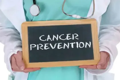 Doctor holding a board with Cancer Prevention message, highlighting the importance of healthy lifestyle choices and early prevention strategies.