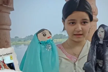 A young student demonstrating handmade cloth puppets as part of an environmental awareness and creative learning project.