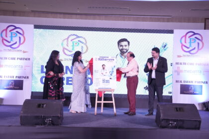 Guests unveil the first edition of Prescription Health Magazine during a grand launch ceremony at Crowne Plaza, Lucknow, as attendees applaud on stage.