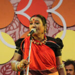 Padma Vibhushan awardee Teejan Bai performing the traditional Pandavani folk art on stage with a tambura in Chhattisgarh.