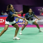 Trisha Jolly and Gayatri Gopichand in action during a women’s doubles badminton match, representing India on the international stage.