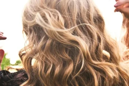 Long, shiny wavy hair highlighting healthy hair care