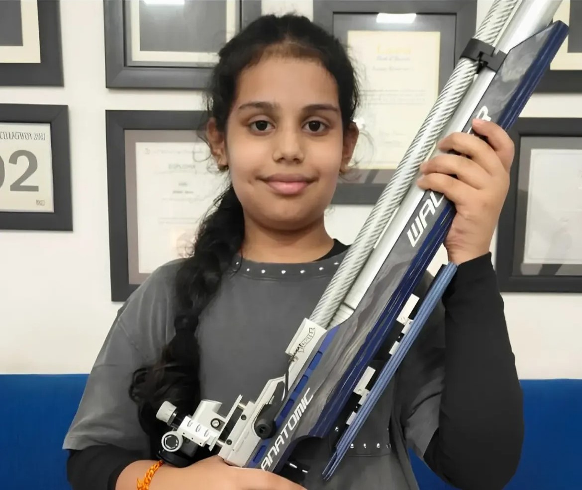 Naira Sharma holding an air rifle after qualifying for the national shooting competition