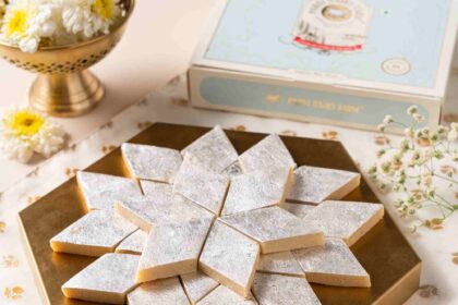 Homemade kaju katli recipe with diamond-shaped cashew barfi pieces arranged on a plate.