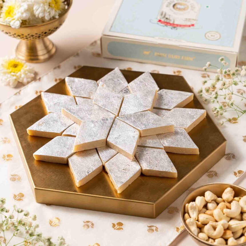 Homemade kaju katli recipe with diamond-shaped cashew barfi pieces arranged on a plate.