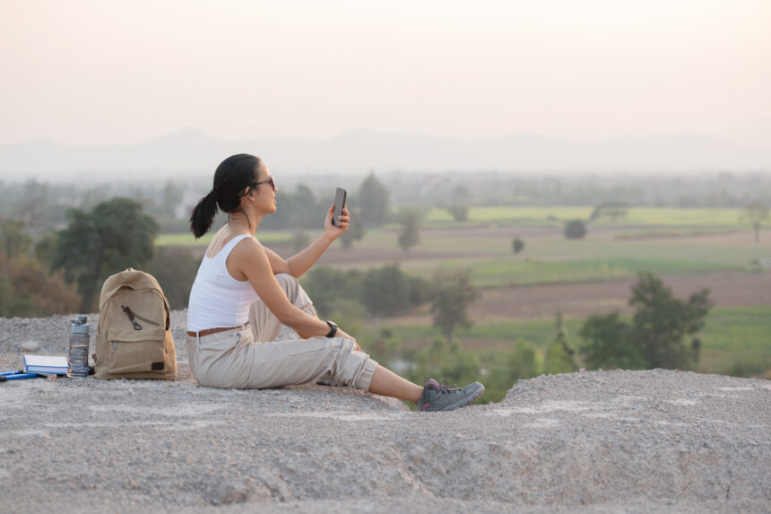 A traveler enjoying a peaceful slow travel experience amid the scenic natural beauty of India.